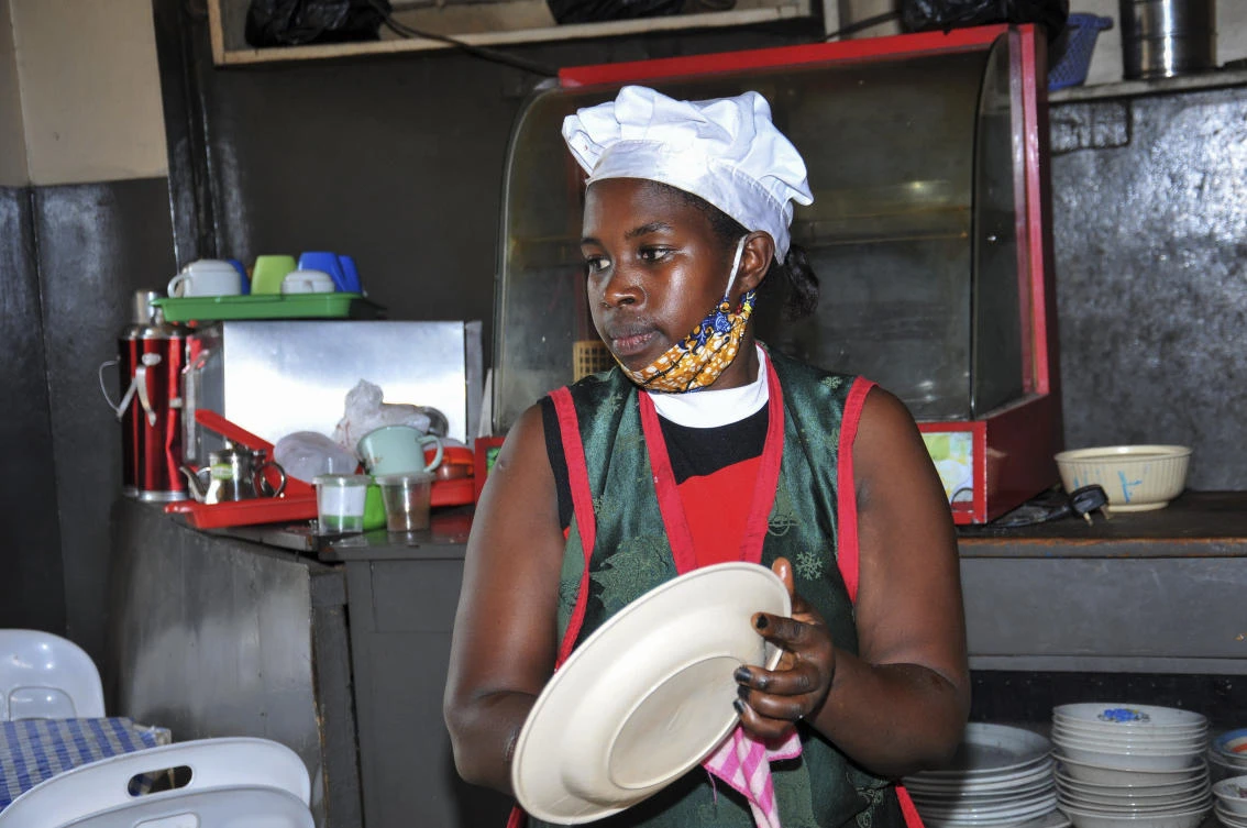 Rebecca Nakamanya works at a restaurant near a bus terminal in capital Kampala, Uganda. (AP)