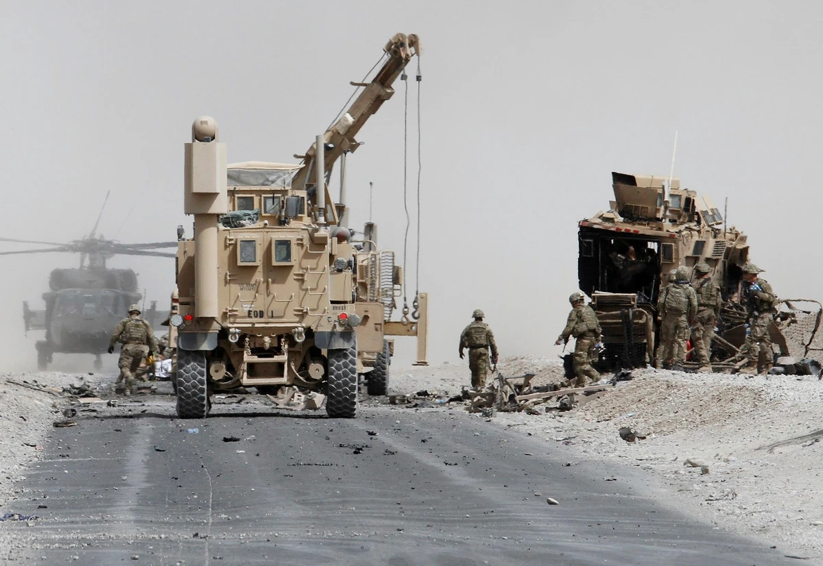 Homemade explosives, often left on roads to target military convoys (pictured) account for most fatalities among US forces. (REUTERS)