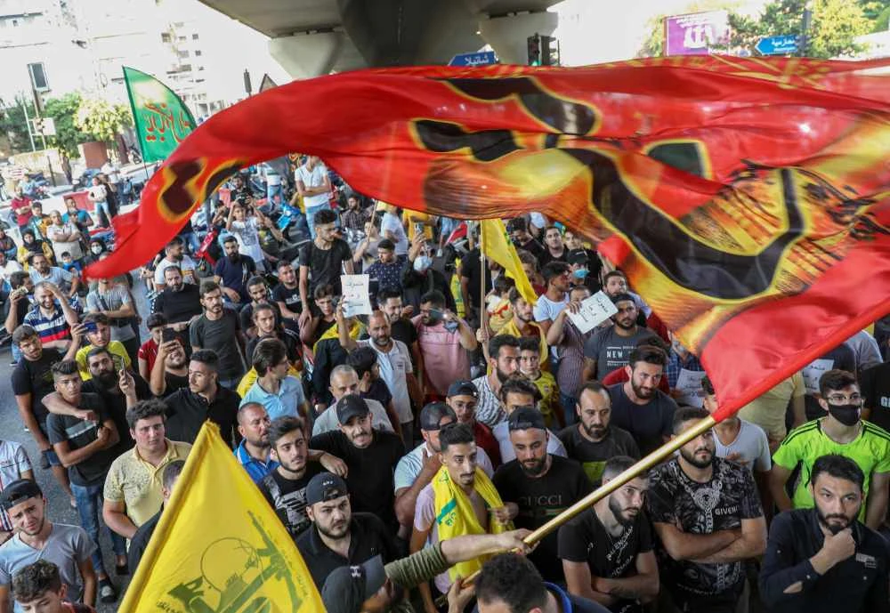 Supporters of the Lebanese Shiite movements Hezbollah and Amal join a rally in the southern suburb of the capital Beirut on June 28, 2020 to protest a statement made by the US ambassador criticizing the group. (AFP / ANWAR AMRO)