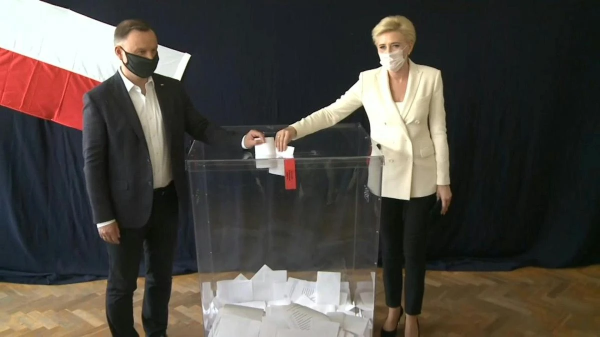 Polish president Andrzej Duda casts his vote in the first round of the country's presidential election. Polls indicate that Duda, backed by the governing Law and Justice (PiS) party, will fall short of a majority and there will need to be a run-off on July 12. (AFP)