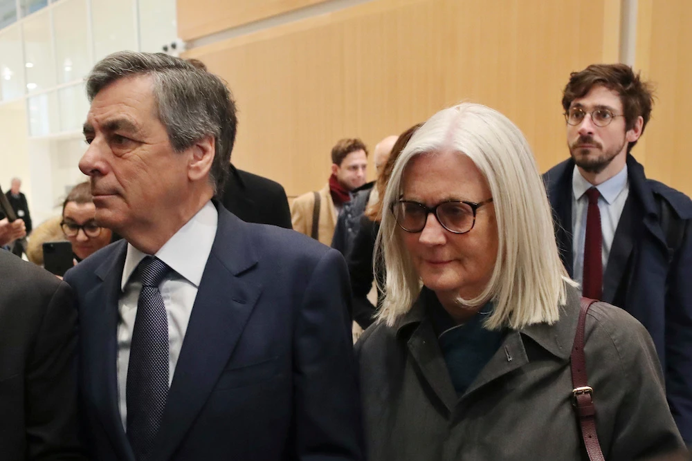 French former prime minister, wife found guilty of fraud