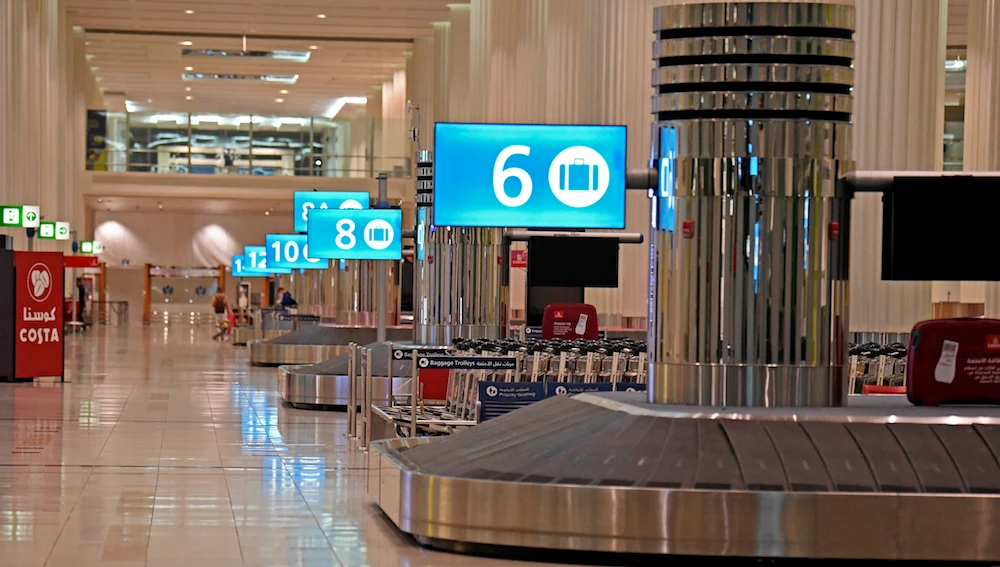 Empty luggage belts are picture at an arrival terminal at Dubai International Airport on May 8, 2020 amid the coronavirus COVID-19 pandemic. (AFP/File Photo)