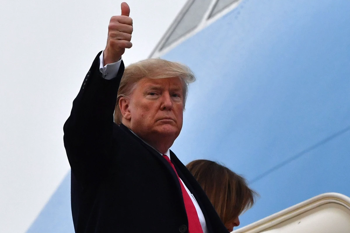 In this file photo, US President Donald Trump gives a thumbs up as he boards Air Force One at Joint Base Andrews in Maryland, January 31, 2020. (AFP/File)