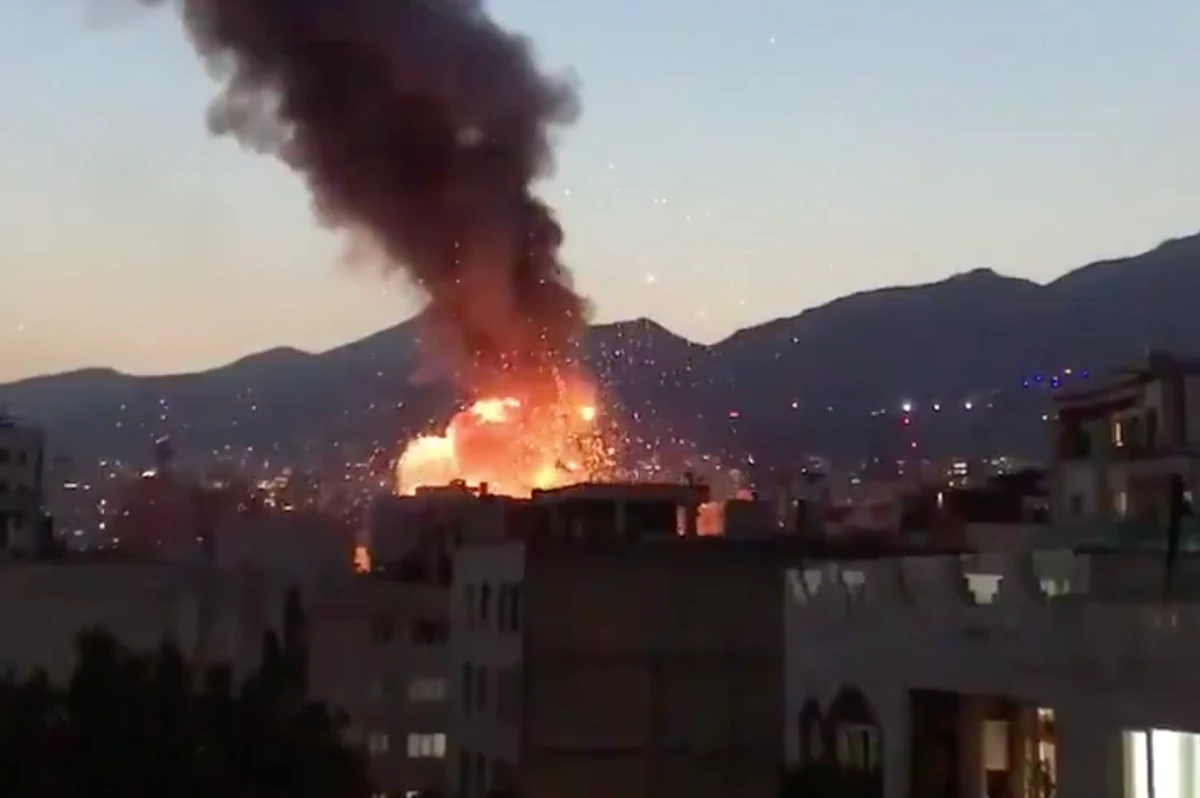 The explosion sent smoke billowing into the night sky over Tehran. (Screengrab)