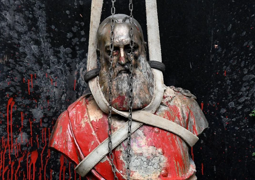 Belgium takes down statue, king regrets colonial violence