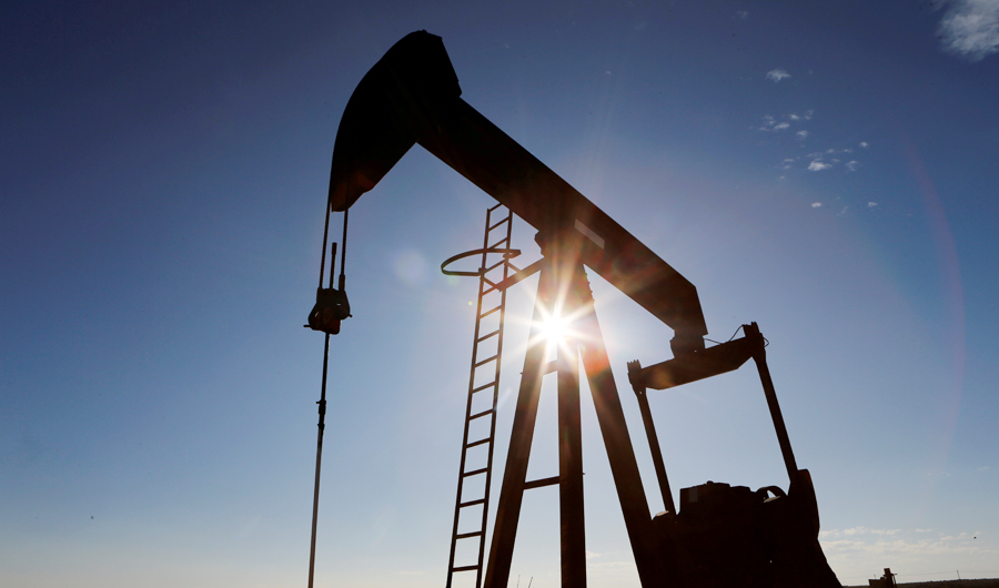 The sun is seen behind a crude oil pump jack in the Permian Basin in Loving County, Texas, U.S., November 22, 2019. (REUTERS)
