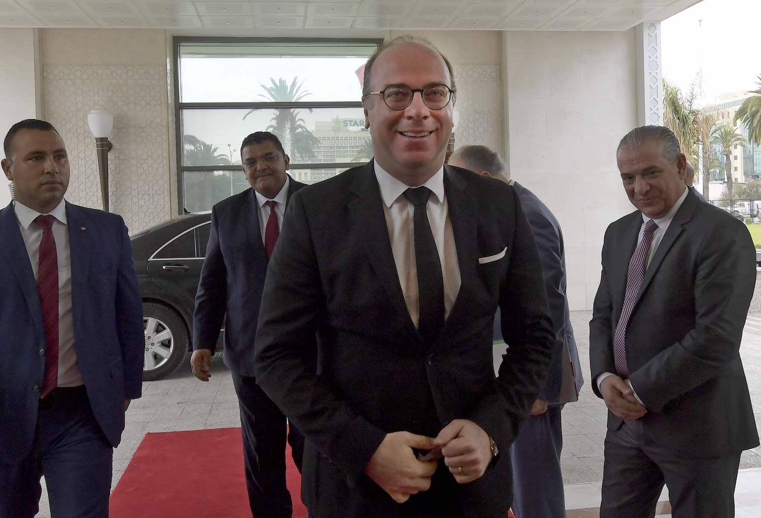 Elyes Fakhfakh arrives to preside over the national conference "to establish decentralisation and local power" in Tunis. (File/AFP)