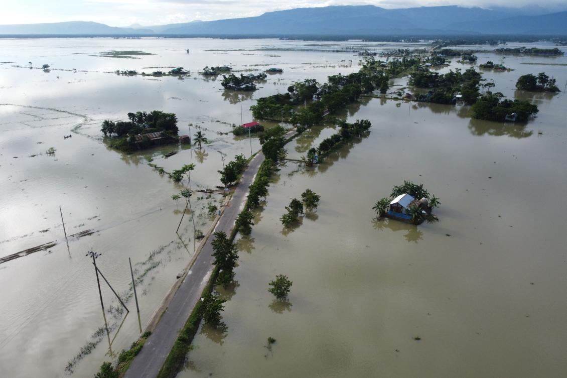 In this aerial photo inundated houses are seen in Sunamgong on July 14, 2020. Almost four million people have been hit by monsoon floods in South Asia, officials said July 14, with a third of Bangladesh already underwater from some of the heaviest rains in a decade. / AFP / Munir UZ ZAMAN