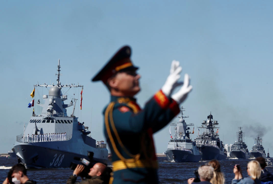 A member of a military band performs as Russian warships sail during the Navy Day parade in Kronstadt near Saint Petersburg, Russia July 26, 2020. REUTERS/Anton Vaganov/Pool