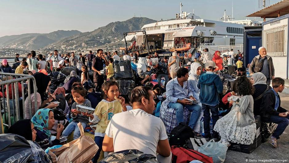 Migrants and refugees wait to board a ship at the port of Mytilene in Greece. The influx of Syrian refugees into Greece after Turkey threw open the doors to Europe along its border has been a major irritant between the two countries. (Photo: Getty Images/AFP)