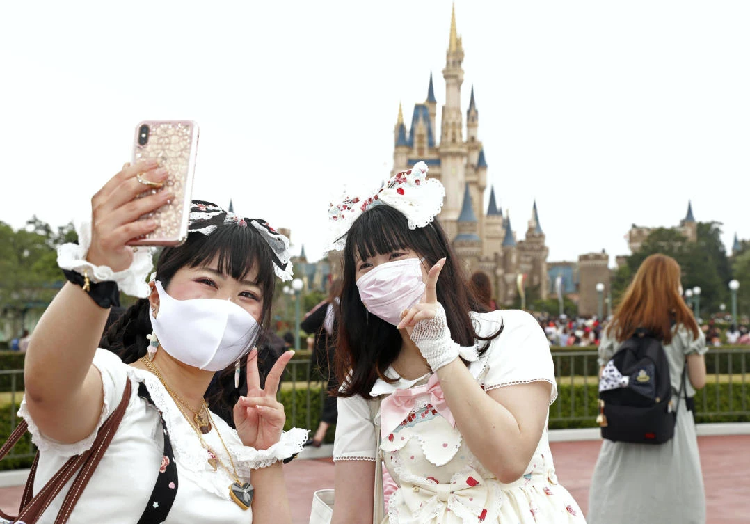 Tokyo Disney Resort will operate at a 50 percent capacity for the foreseeable future, while parades and shows remain suspended. (Kyodo News via AP)