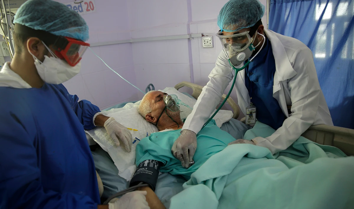 In this, June 14, 2020 file photo, medical workers attend to a COVID-19 patient in an intensive care unit at a hospital in Sanaa, Yemen. (AP)