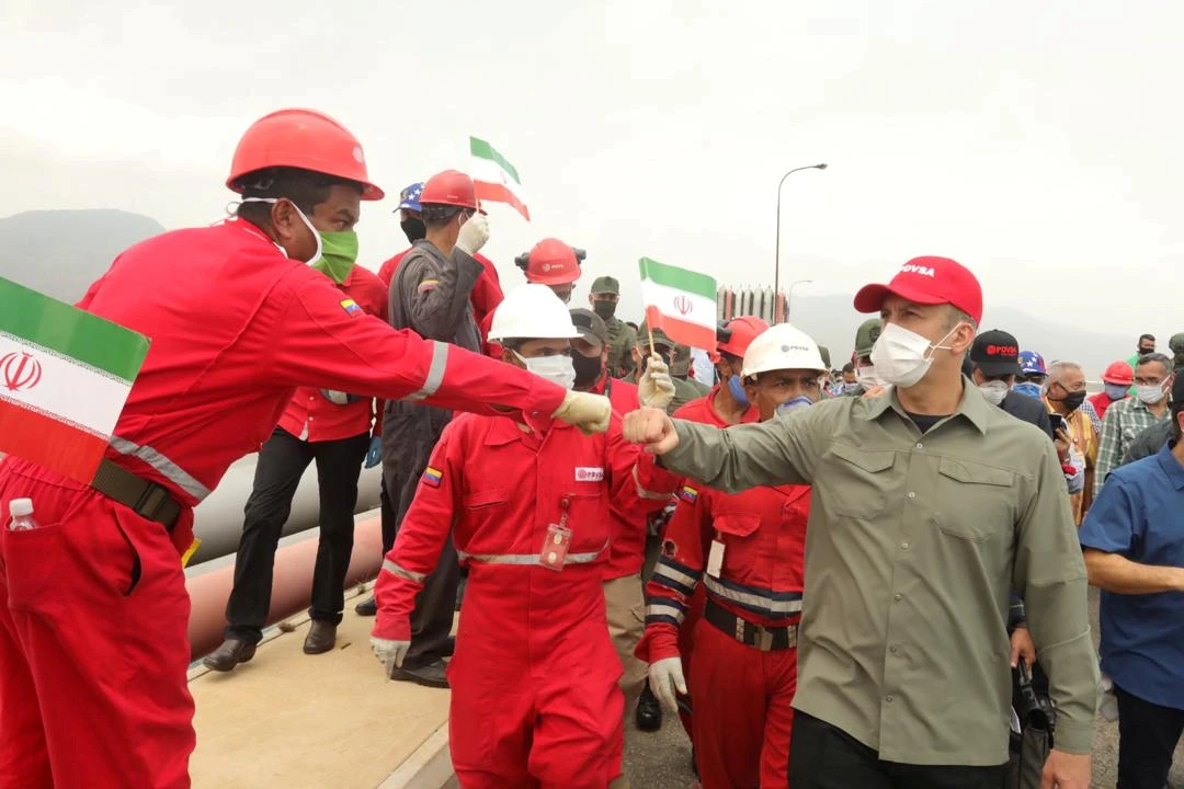 A worker of oil company Pdvsa greets Venezuela's Oil Minister Tarek El Aissami during the arrival of the Iranian tanker ship "Fortune" at El Palito refinery in Puerto Cabello, Venezuela. (File/Reuters)