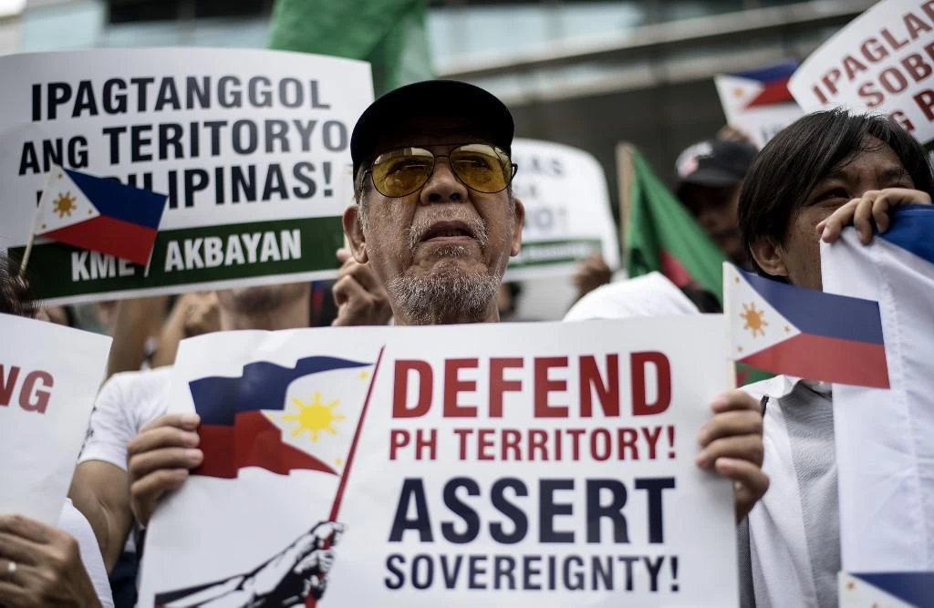 Above, activists participate on a protest in front of the Chinese consular office in Manila on July 12, 2018. (AFP file photo)