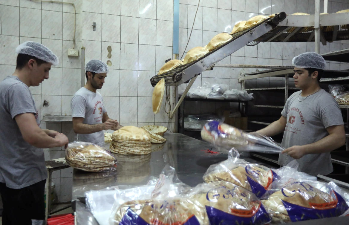 Workers pack bread at a bakery in Beirut, Lebanon June 30, 2020. (Reuters/Mohamed Azakir)