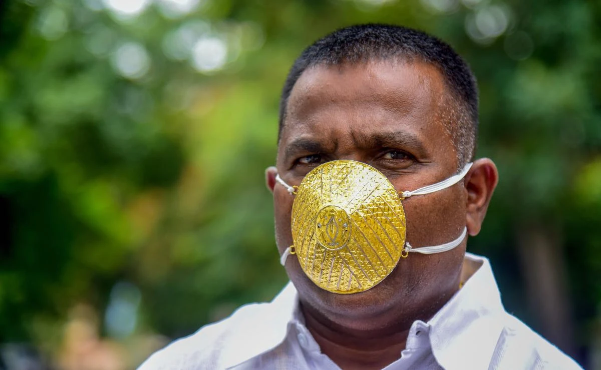 Businessman Shankar Kurhade wears a facemask made of gold and being worth 289,000 rupees ($4,000) amid concerns over the COVID-19 coronavirus outbreak, in Pune on July 4, 2020. (AFP)