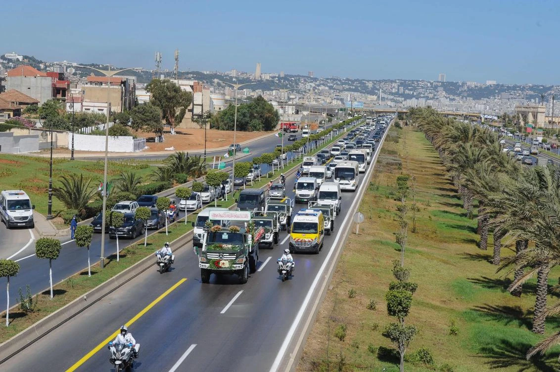 A convoy of coffins containing the remains of 24 Algerian resistance fighters heads towards their final resting place at El-Alia cemetery on July 5, 2020. (AFP)