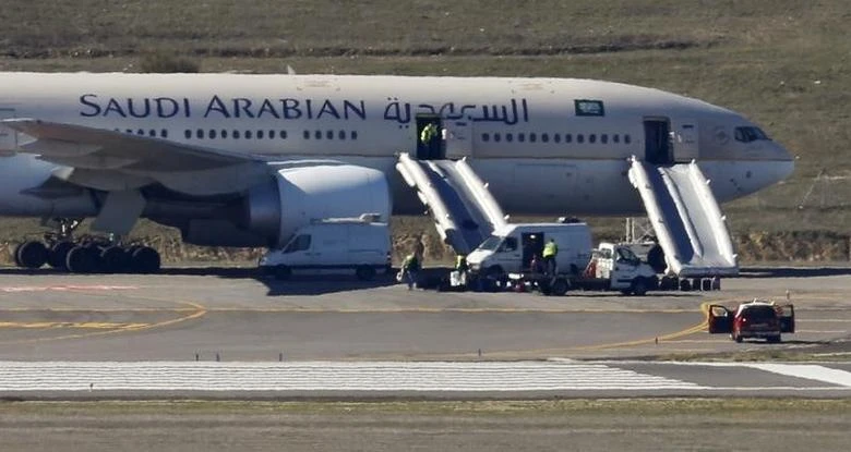 Saudi Arabian Airlines flight SVA 226 is isolated on the tarmac after its passengers and crew were evacuated following a bomb threat, at the Barajas airport in Madrid, Spain, February 4, 2016. (Reuters)