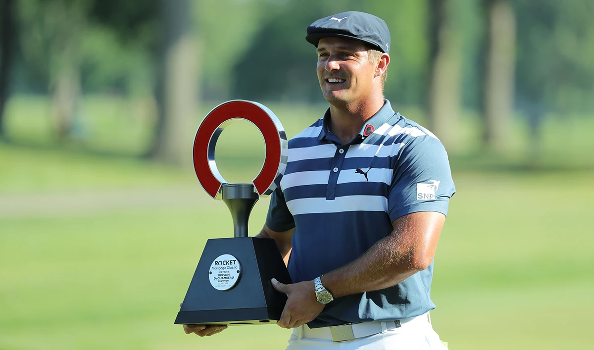 Bryson DeChambeau with the trophy after winning the Rocket Mortgage Classic on Sunday at the Detroit Golf Club. (AFP)