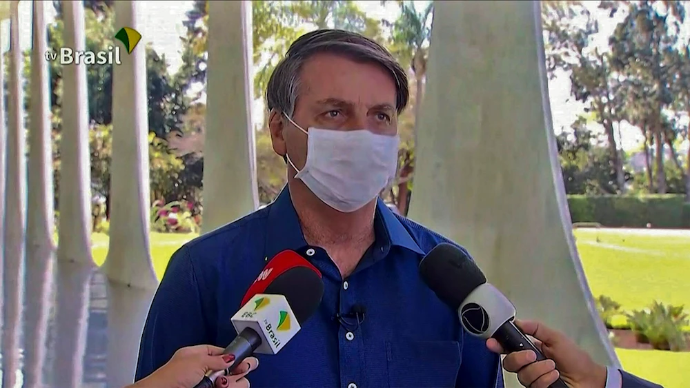 Screen grab of TV Brasil showing Brazilian President Jair Bolsonaro speaking in Brasilia on July 7, 2020. Brazil President Jair Bolsonaro announced on Tuesday he had tested positive for the coronavirus but said he was feeling “perfectly well” and had only mild symptoms. (AFP/TV Brasil)