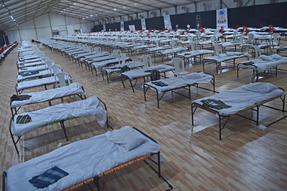 Beds are pictured inside a newly built recovery centre for Covid-19 coronavirus patients, in Mumbai on July 7, 2020. India on July 6 became the country with the third-highest coronavirus caseload in the world, as a group of scientists said there was now overwhelming evidence that the disease can be airborne -- and for far longer than originally thought. (AFP)