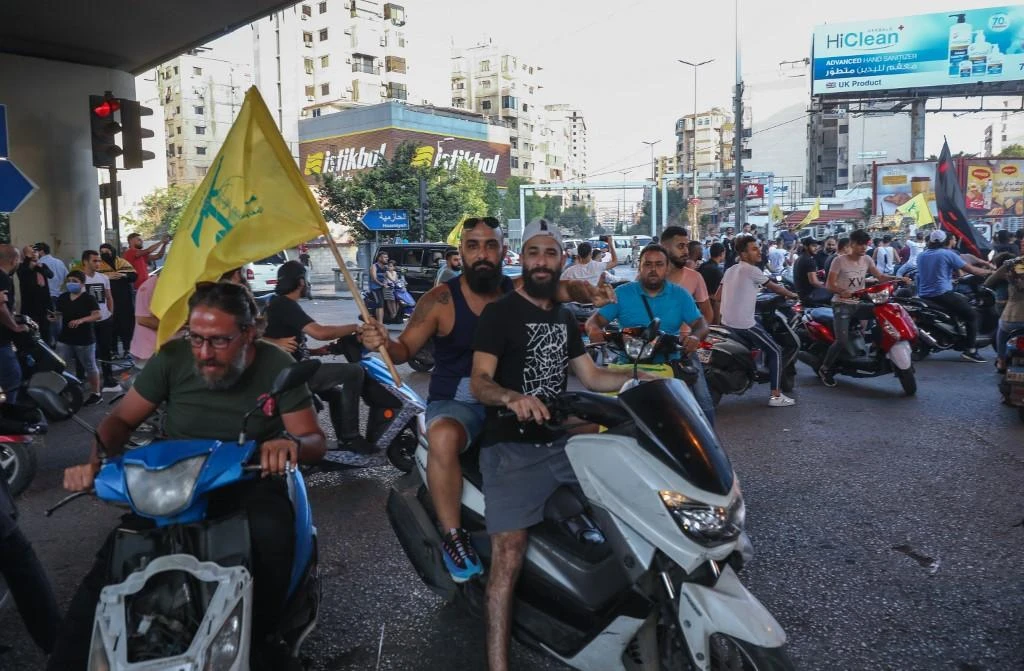 Supporters of the Lebanese Shiite movements Hezbollah and Amal ride motorbikes as they protest a statement made by the US ambassador criticising the former group on June 28, 2020. (File/AFP)