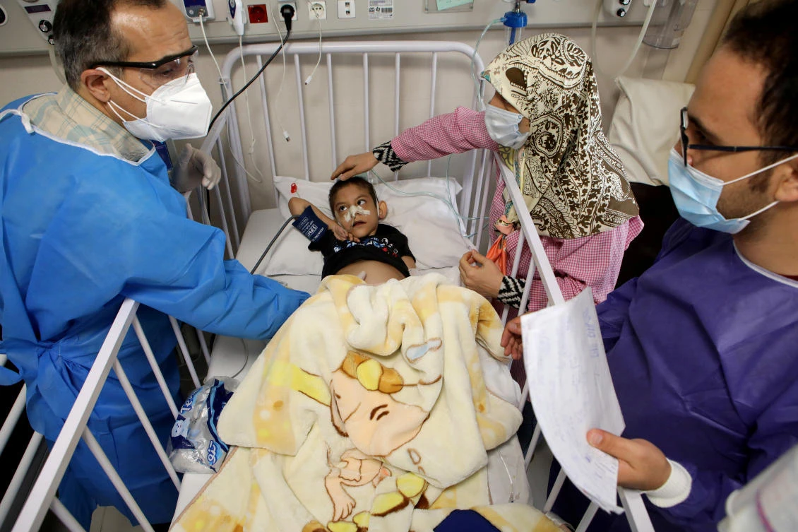 Amirali, a boy suspected to be infected with the coronavirus disease (COVID-19), is treated at Mofid children's hospital, in Tehran, Iran, July 8, 2020. (West Asia News Agency/Reuters)