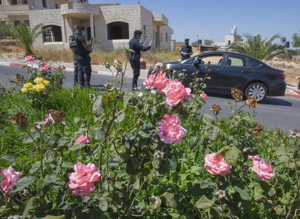 In this July 2, 2020, file photo, a Palestinian security unit mans a checkpoint at an entrance of in the West Bank city of Ramallah. (AP)