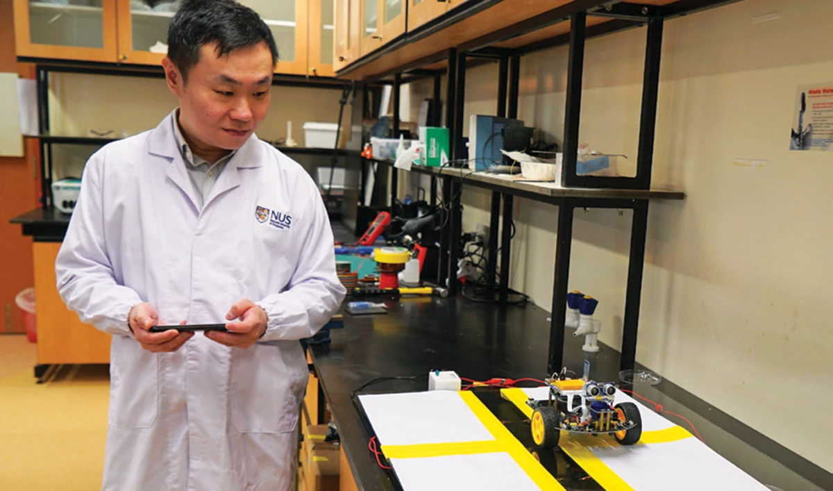 Dr. Swee Ching Tan tests the shadow effect generator device in his lab. (Reuters)