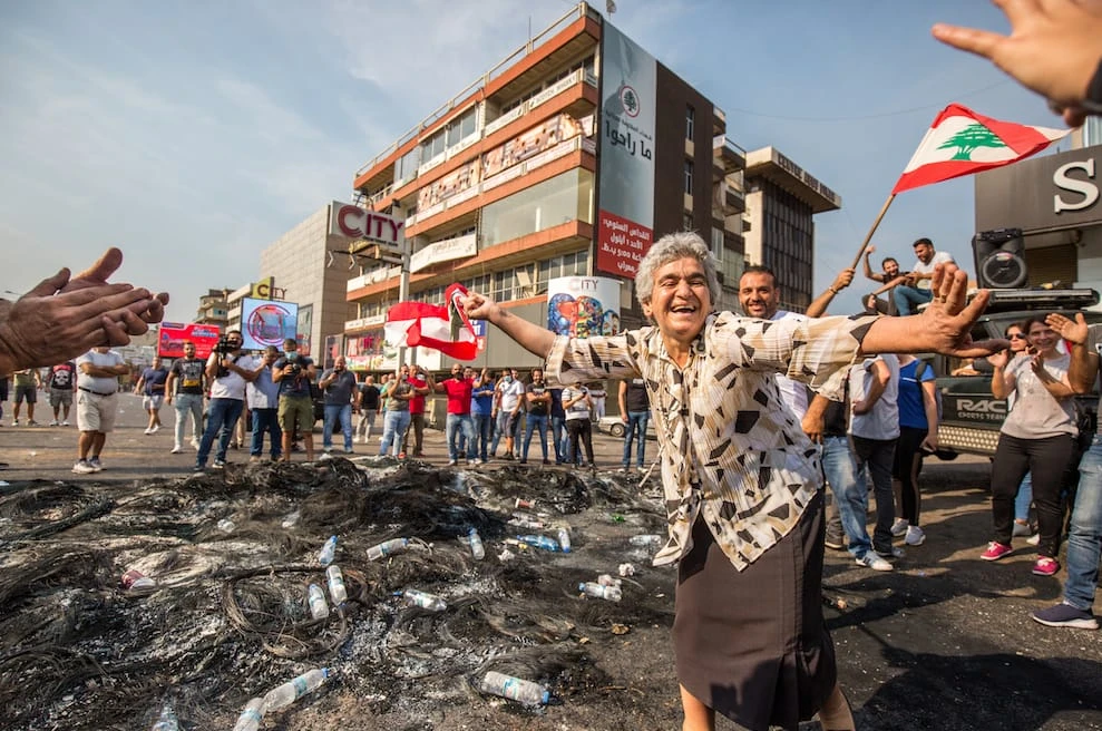 A woman dances on October 18, 2019, day two of the uprisings in Jounieh.
