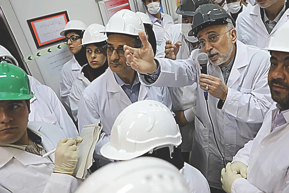 Head of Iran’s Atomic Energy Organization Ali Akbar Salehi addresses workers during a visit to the Natanz nuclear research site, south of Tehran. The showpiece facility was crippled by an explosion on July 2. (AFP)