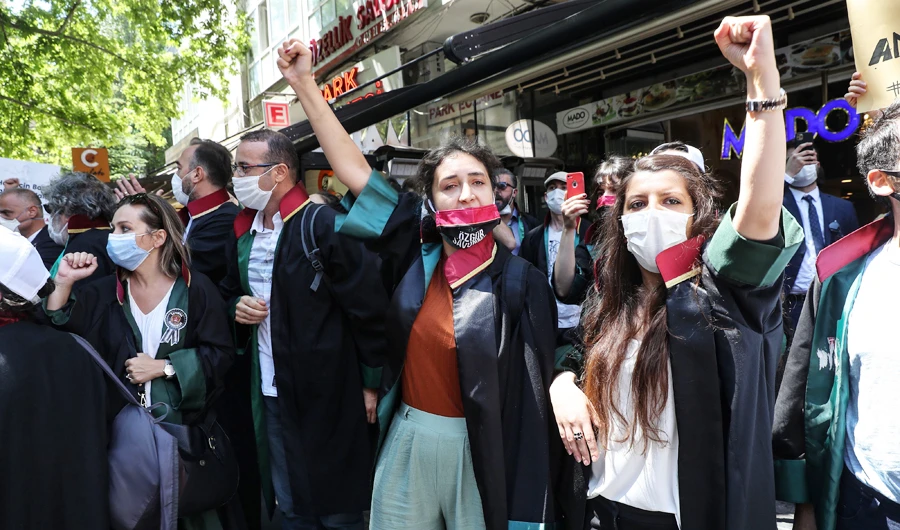Protesting lawyers take part in a demonstration against a government draft bill on changing the system of bar associations on July 10, 2020, in Ankara. (AFP)
