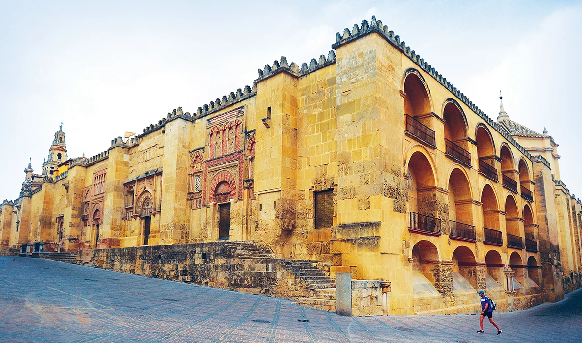 A tourist walks around The Mezquita in Cordoba after the national lockdown put in place to fight the coronavirus pandemic was lifted In Spain. (AFP)