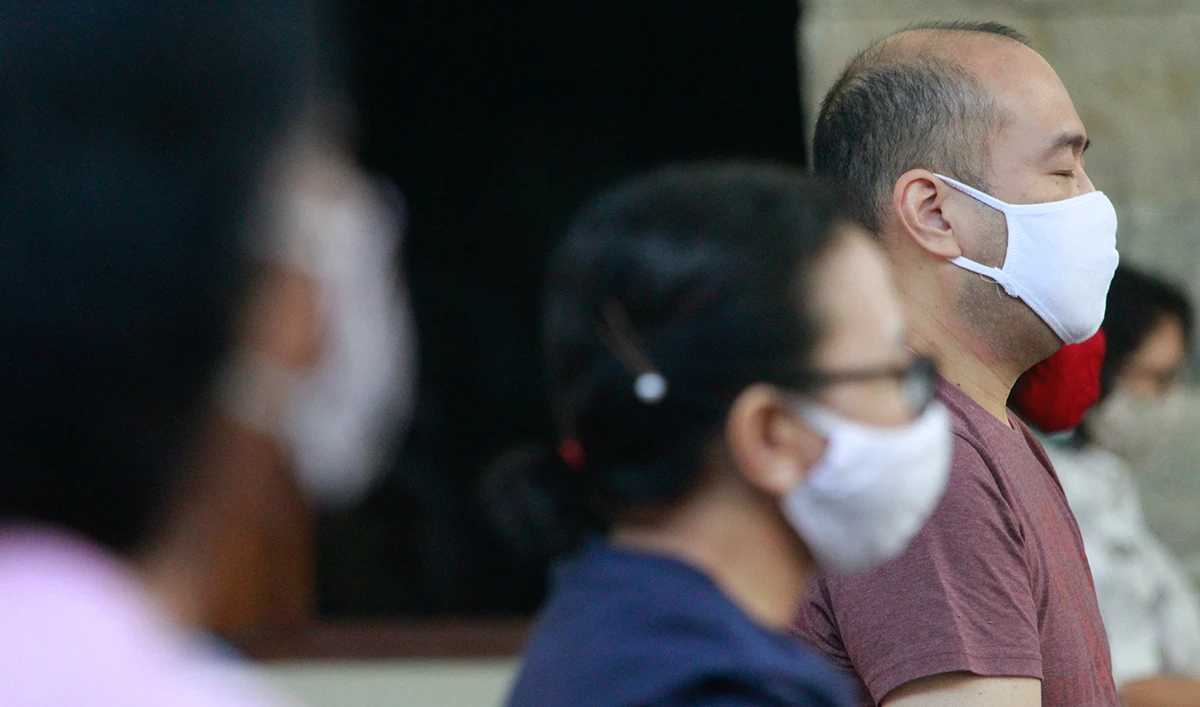 People wearing protective face masks attend mass on the first day of the reopening of a church after government restrictions were eased, amid the coronavirus disease (COVID-19) outbreak, in Jakarta, Indonesia, July 12, 2020. (Reuters)
