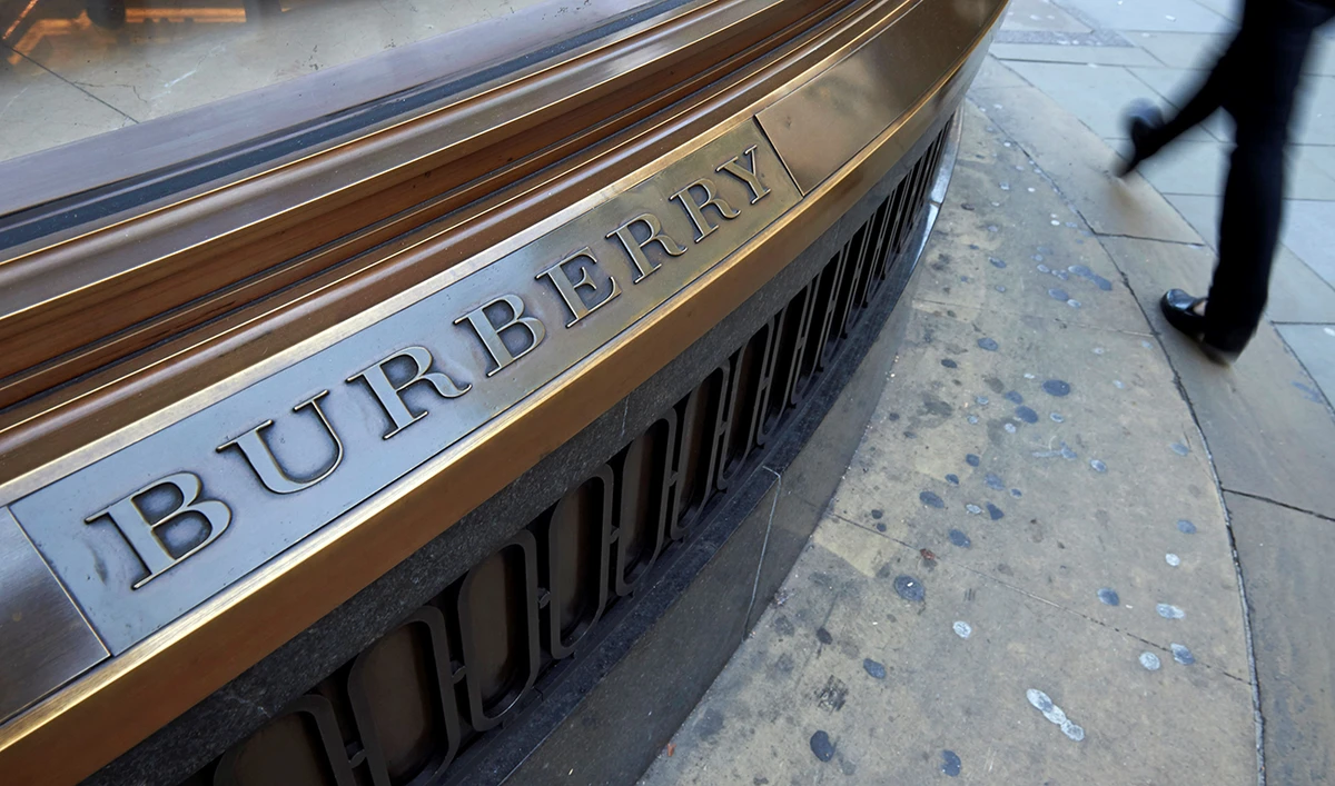 A pedestrian passes the Burberry store as they walk along Regent Street in central London. (AFP/File)