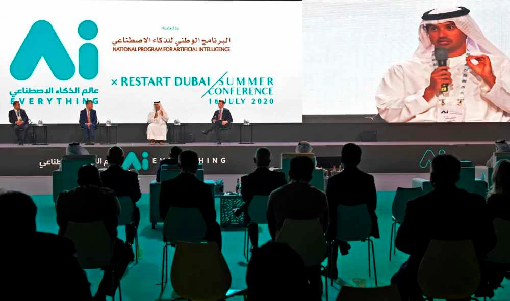 (Podium L to R) Emirates' divisional senior vice president Boutros Boutros, Dubai Airports CEO Paul Griffiths, and Director General of Dubai's Department of Tourism and Commerce Marketing (Dubai Tourism) Helal Saeed al-Marri, attend the Restart Dubai Summer Conference in the Gulf emirate of Dubai on July 16, 2020. (AFP / KARIM SAHIB)