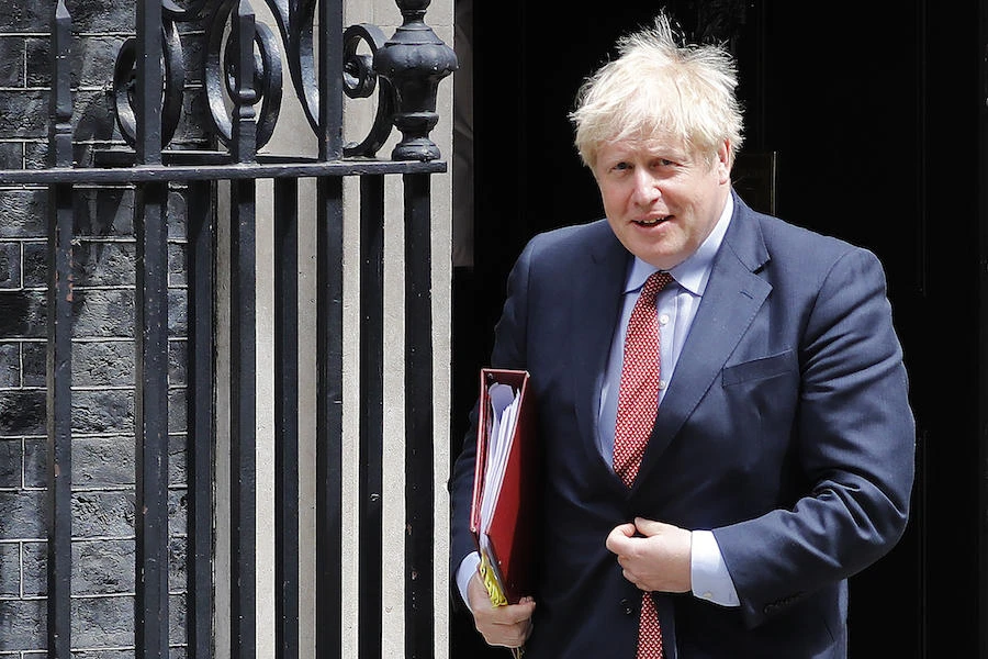 Britain's Prime Minister Boris Johnson leaves 10 Downing Street in central London on July 15, 2020 ahead of the weekly Prime Minister's Questions (PMQs) session in the House of Commons. (AFP)