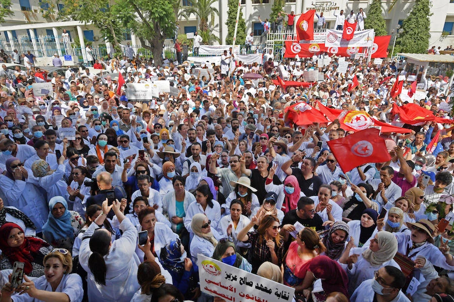Tunisia public health workers shout slogans against the government during a general strike on June 18, 2020 in front of the headquarters of the ministry of health in Tunis. (AFP)