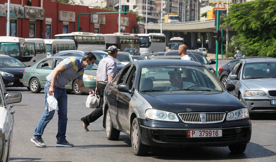 A man speaks to a taxi driver in Beirut, Lebanon. (Reuters)