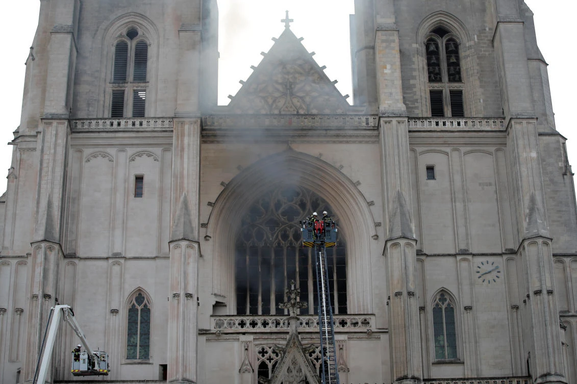 French firefighters battle a blaze at the Cathedral of Saint Pierre and Saint Paul in Nantes, France, July 18, 2020. (Reuters)