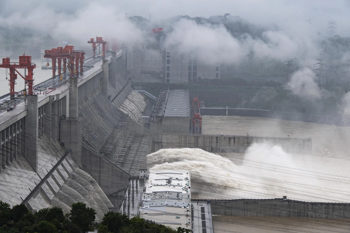 In this photo released by China's Xinhua News Agency, water flows out from sluiceways at the Three Gorges Dam on the Yangtze River near Yichang in central China's Hubei Province, Friday, July 17, 2020. (AP)