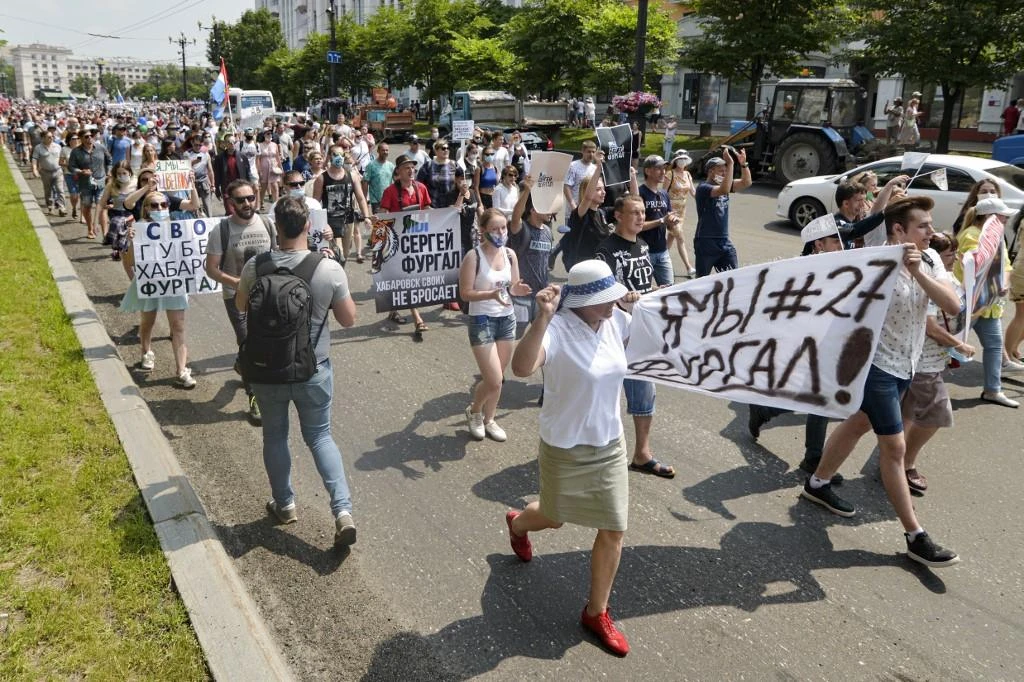 People hold banners and signs during an unauthorised rally in support of Sergei Furgal, the governor of the Khabarovsk region who was arrested a week ago, in the Russian far eastern city of Khabarovsk on July 18, 2020. (AFP)