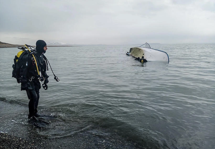 A rescue diver stands on the shores of Lake Van after a boat carrying refugees and migrants sank in eastern Turkey on December 26, 2019. (File/AFP)