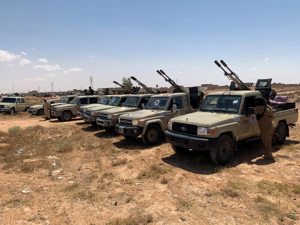 Troops loyal to Libya's internationally recognized government are seen in military vehicles as they prepare before heading to Sirte, on the outskirts of Misrata, Libya, July 18, 2020. (Reuters)
