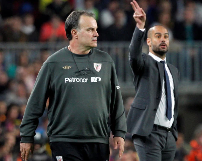 Barcelona’s coach Pep Guardiola, right, and Athletic Bilbao’s coach Marcelo Bielsa during a Spanish league match at the Camp Nou in Barcelona, March 31, 2012. (Reuters)