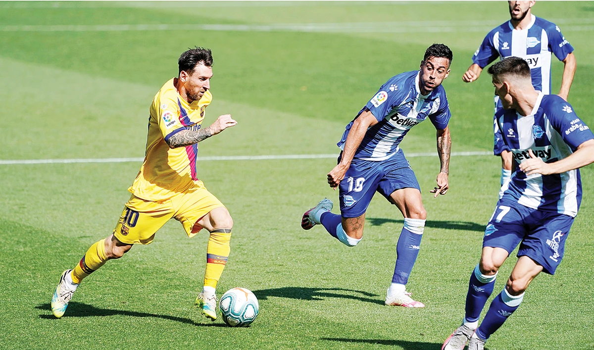 Barcelona’s Lionel Messi in action during the match against Osasuna in the Spanish league on Sunday. Barcelona won 5-0 to close out their season. (Reuters)