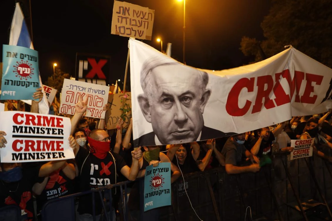 Israelis protest against Prime Minister Benjamin Netanyahu in Jerusalem, on July 21, 2020. (AFP)
