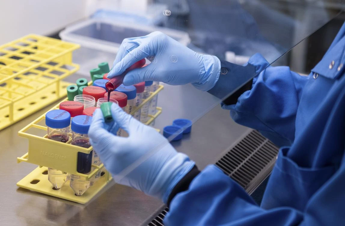 In this handout photo released by the University of Oxford blood samples from coronavirus vaccine trials are handled inside the Jenner Institute in Oxford, England. (File/AP)