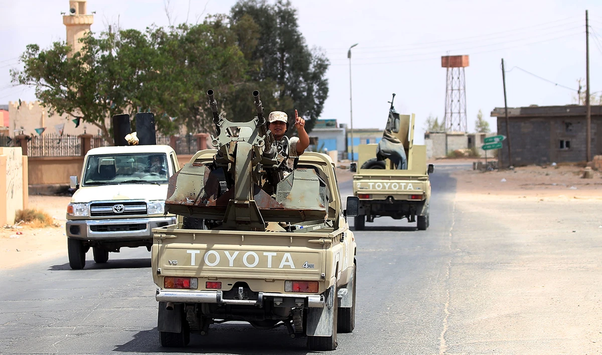 Fighters loyal to the UN-recognized Libyan Government of National Accord (GNA) secure the area of Abu Qurain, half-way between the capital Tripoli and Libya's second city Benghazi, against forces loyal to Khalifa Haftar, who is based in eastern Benghazi, on July 20, 2020. (AFP)