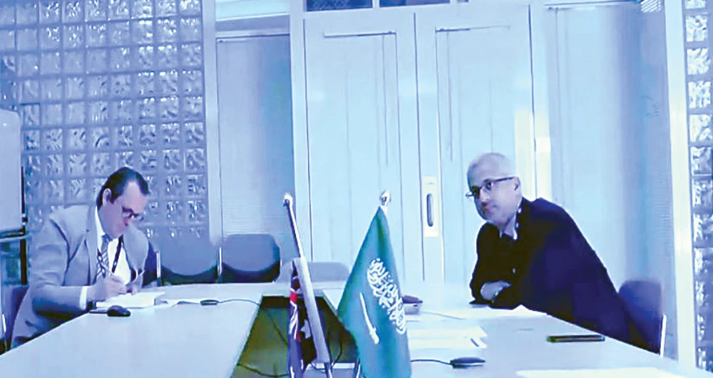 Australian Ambassador to Saudi Arabia Ridwaan Jadwat and KSRelief chief Dr. Abdullah Al-Rabeeah discuss efforts to combat COVID-19 pandemic. (SPA)